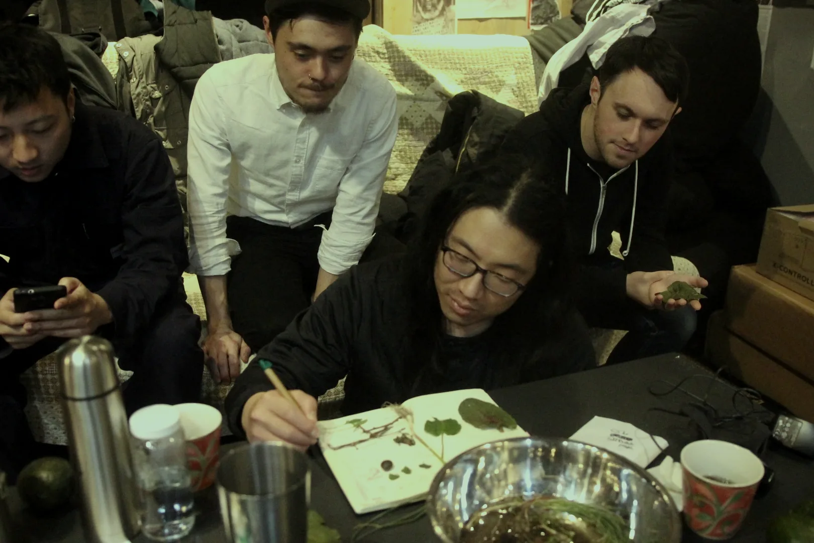 A group gathered around a table for a workshop