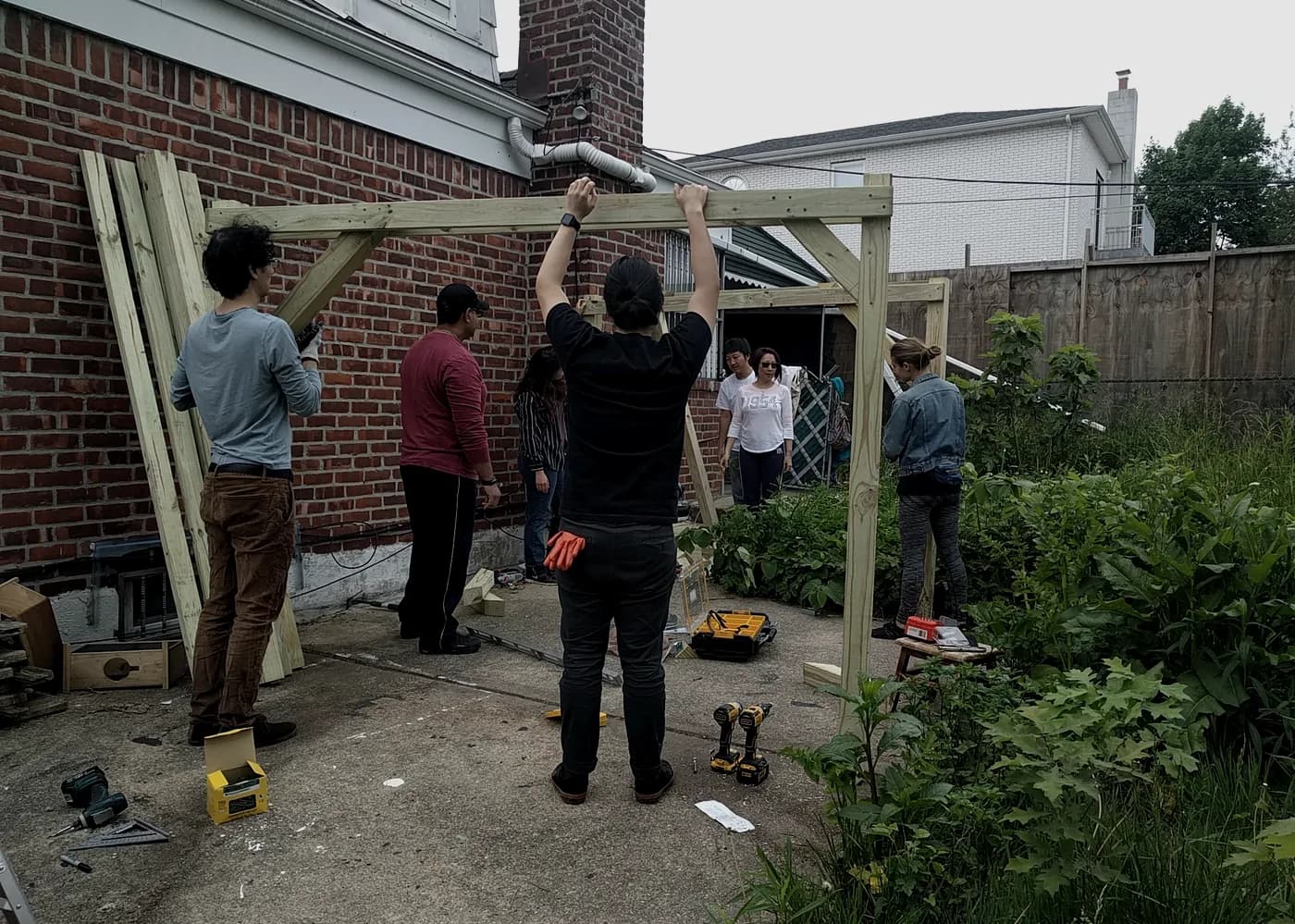A group raising a timber frame
